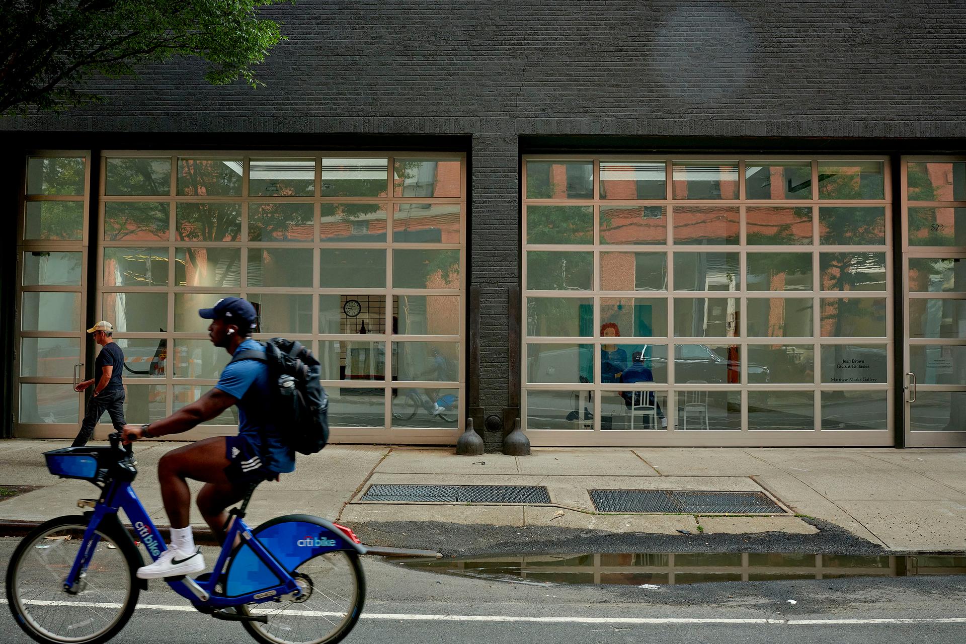 A person bikes in front of Gagosian in Chelsea